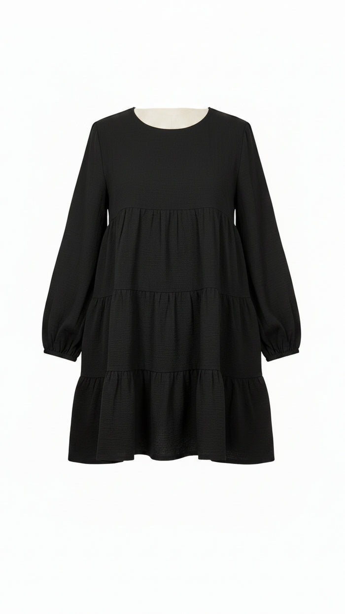 A black long-sleeve tiered dress with a crew neck
