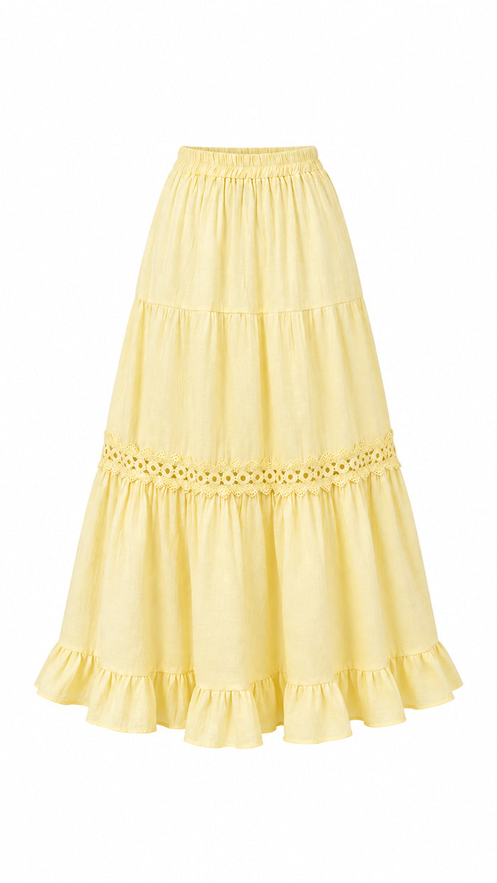 A light yellow tiered skirt with eyelet lace trim and ruffled hems