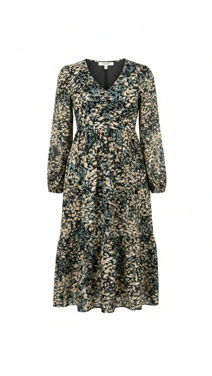 A long-sleeve knee-length floral dress with a dark green, beige, and white pattern