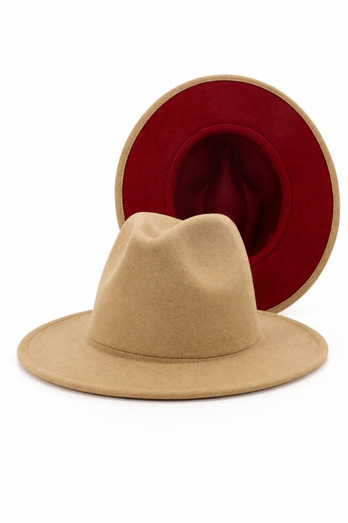 A light tan felt hat, a deep red interior